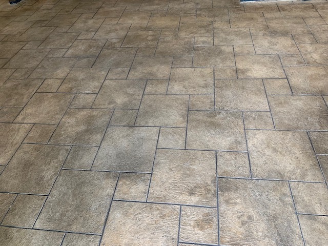 cementitious flooring on patio 1 large one small squares